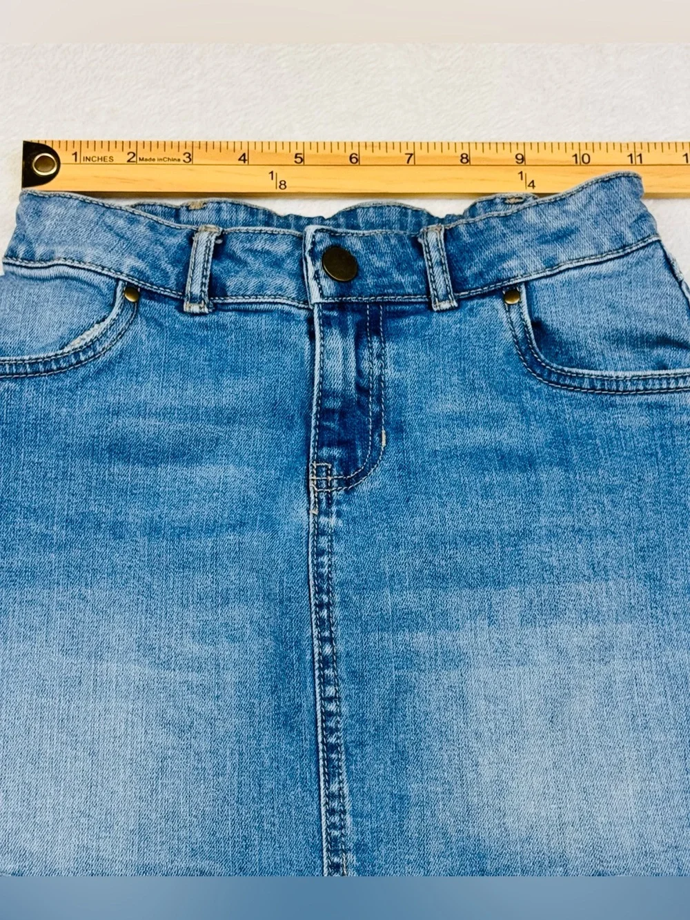 Lot of 2 girls denim skirts. The blue shirt is a size 8, black skirt is size 7/8